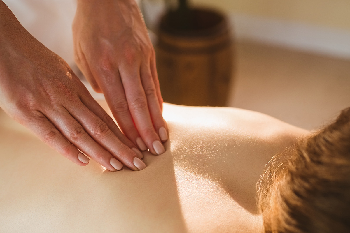 Full body massage in a spa setting to relax muscles and relieve tension
